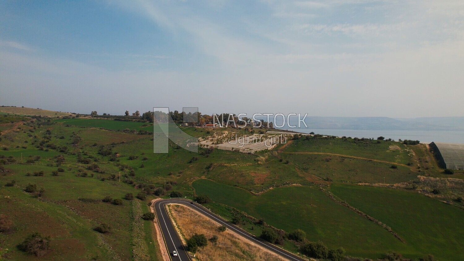 drone footage of a distant view of the Tiberias Church of the Beatitudes,  tourism in Palestine,  Bethlehem