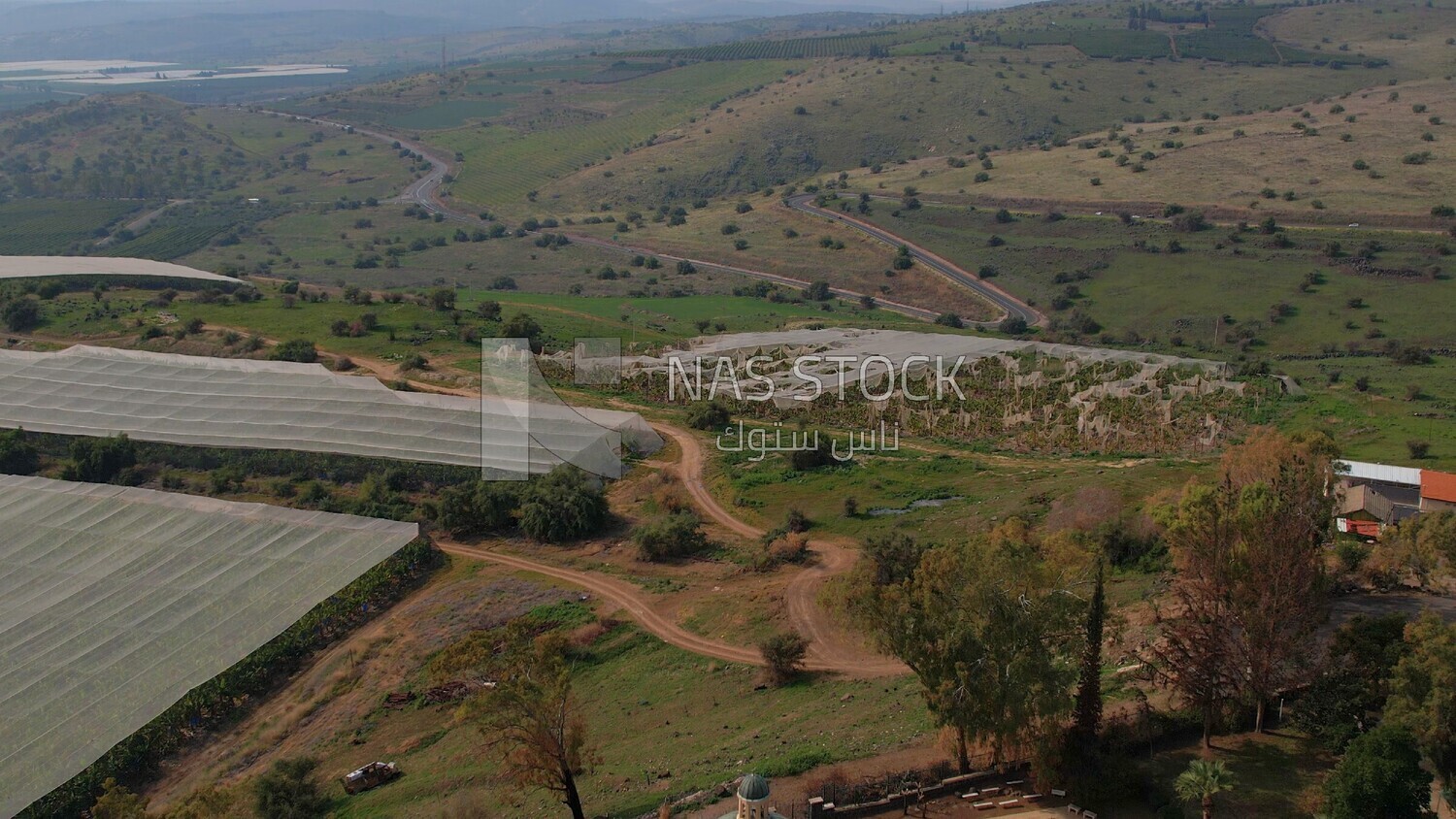 drone footage of a distant view of the Tiberias Church of the Beatitudes,  tourism in Palestine,  Bethlehem