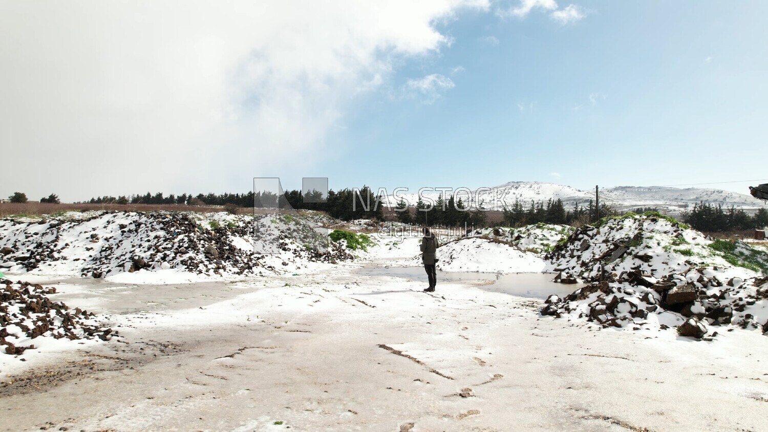 Drone footage of the Majdal Shams village on a snowy day, landscape waterfall, tourism in Palestine