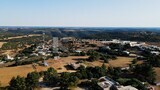 Drone footage shows an overview of buildings with trees in Libya, Libya, history of Libya, landmarks in Libya