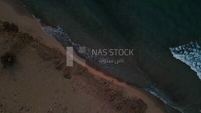 drone footage of overview of the sea in Libya at sunset