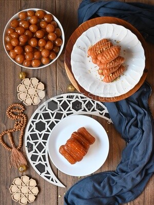 group of oriental sweets in a Ramadan atmosphere , Zalabia , Balah El Sham ​