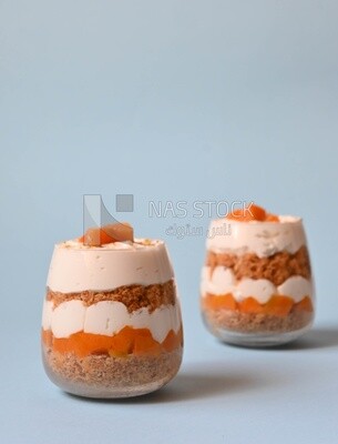 Two cups of kunafa with mango and cream, Ramadan sweets