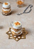 Two cups of kunafa with mango and cream, Ramadan sweets