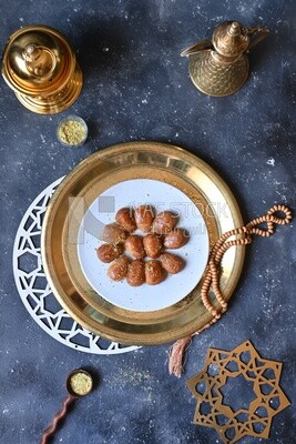 Plate of Remosh El Set with nuts, oriental Arabic sweets, Ramadan sweets