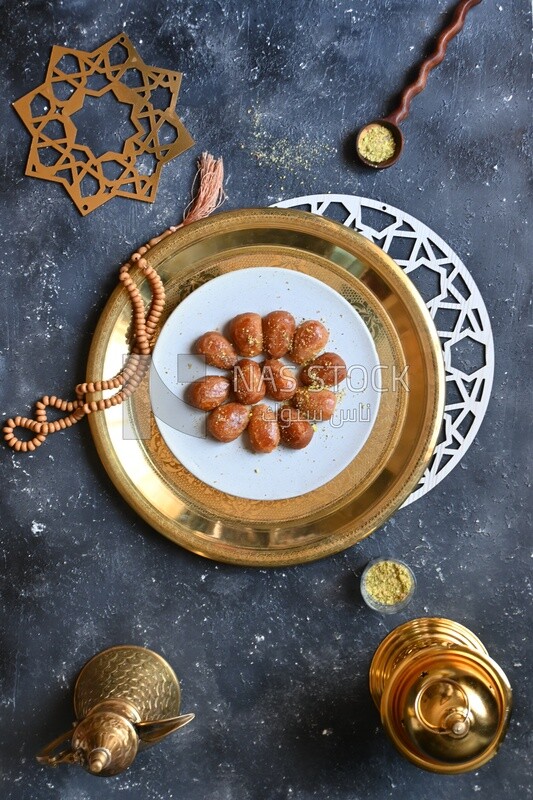 Plate of Remosh El Set with nuts, oriental Arabic sweets, Ramadan sweets