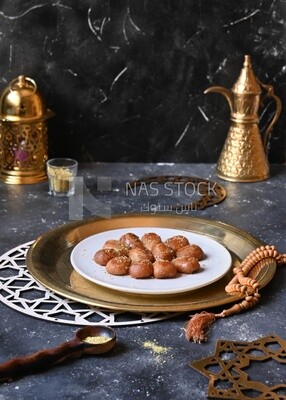 Plate of Remosh El Set with nuts, oriental Arabic sweets, Ramadan sweets