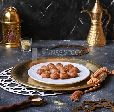 Plate of Remosh El Set with nuts, oriental Arabic sweets, Ramadan sweets