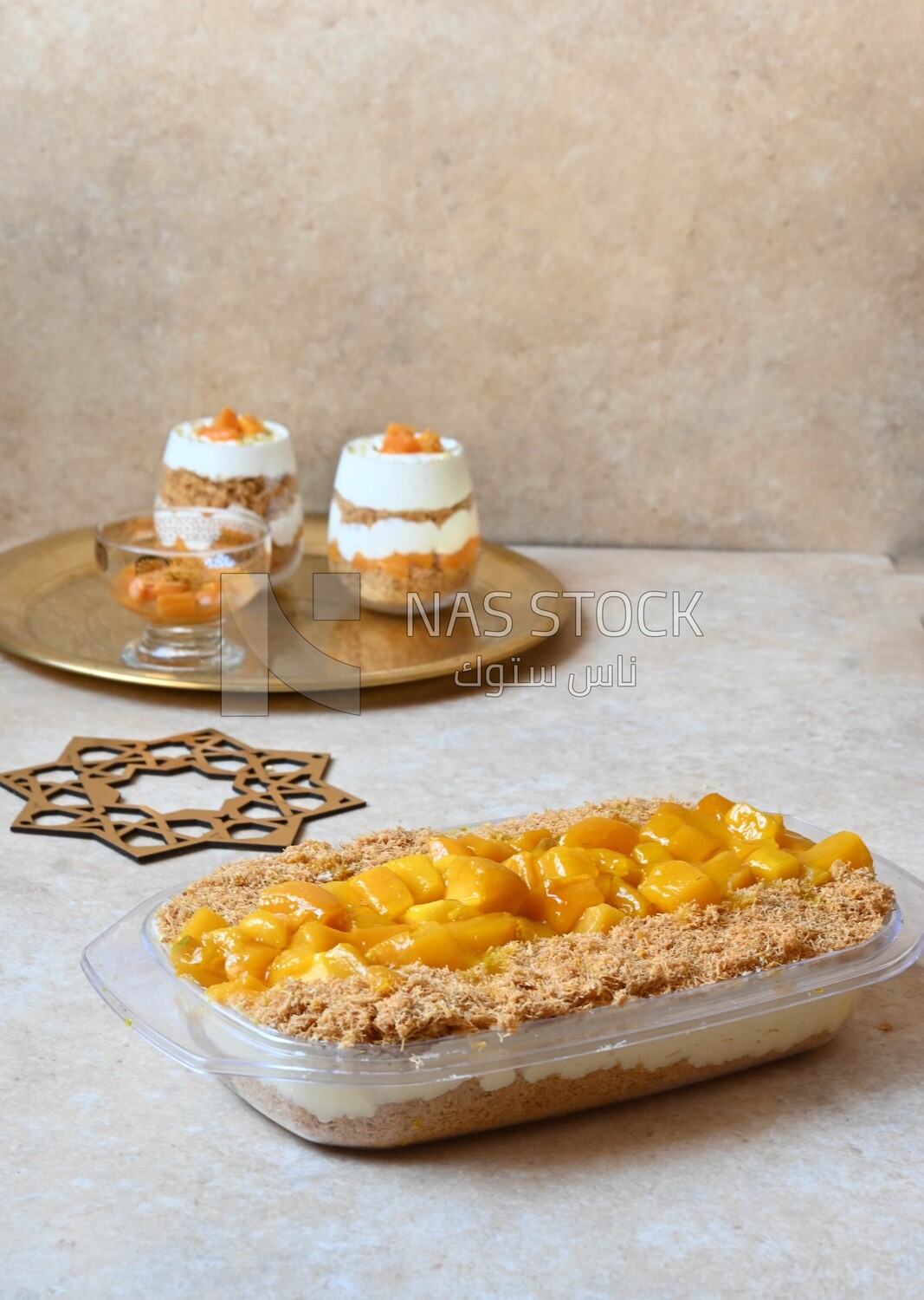 Tray of kunafa with mango and cream, Ramadan sweets