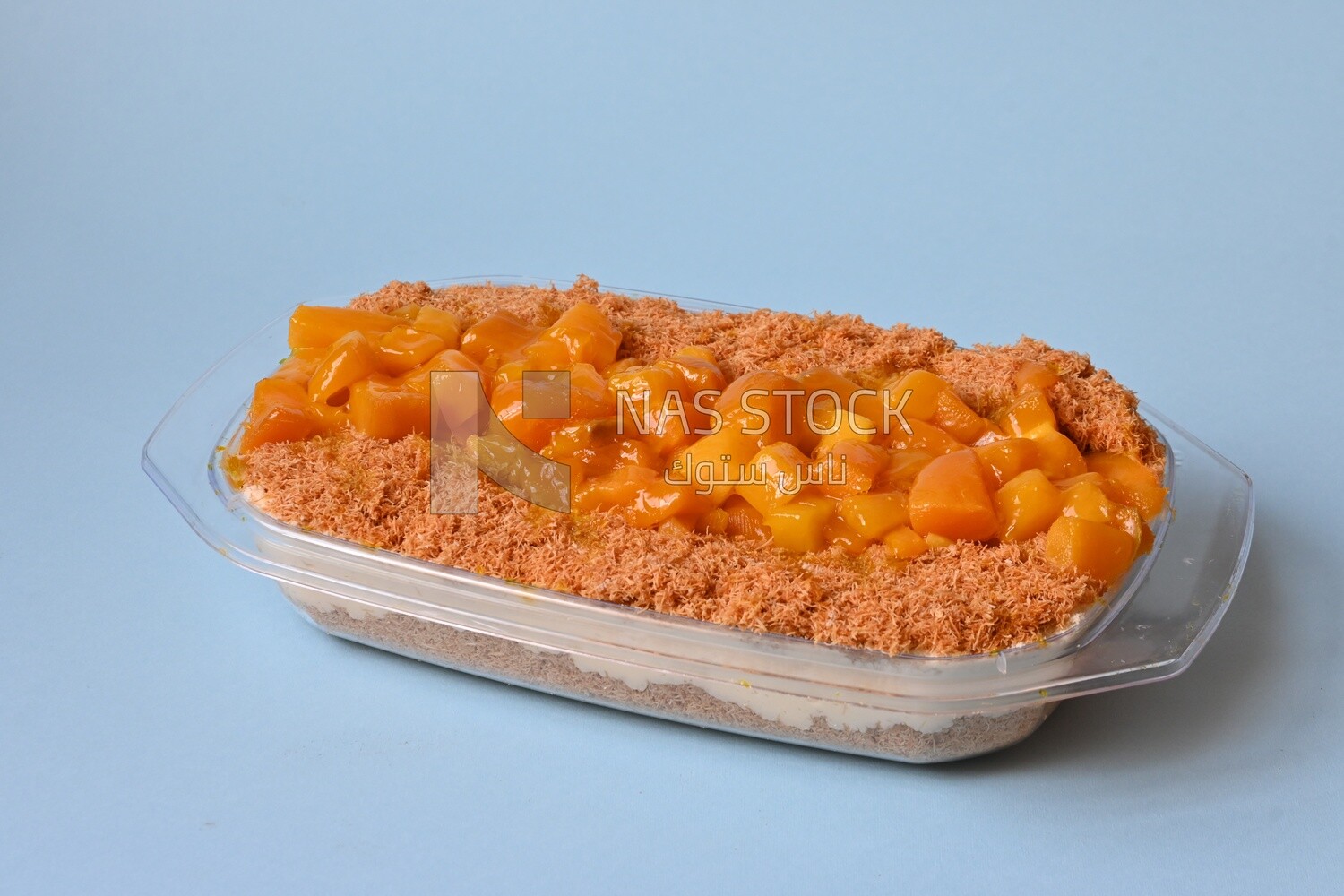 Tray of kunafa with mango and cream, Ramadan sweets