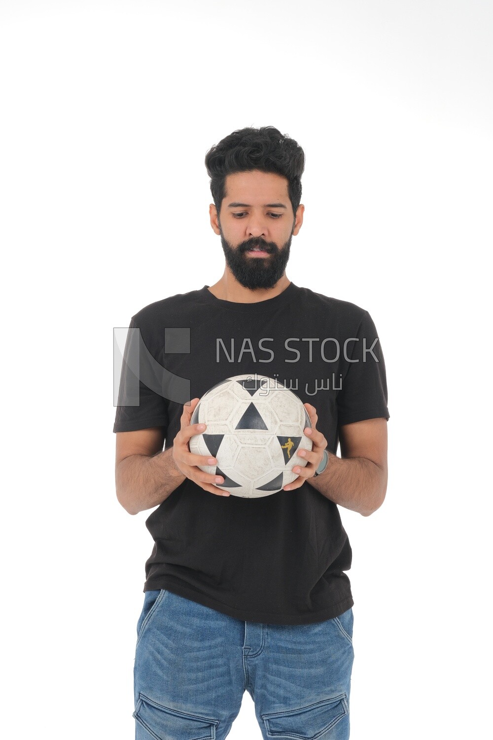 Saudi man holding a ball, playing football,  practicing soccer sports, playing with the ball, white background, Saudi model