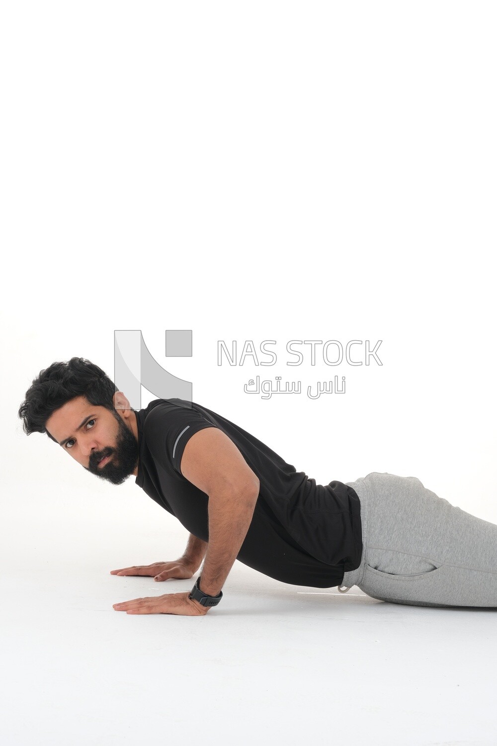 Saudi man doing warm-up exercises, push-ups, bodybuilding, healthy lifestyle, building muscle, white background, Saudi model