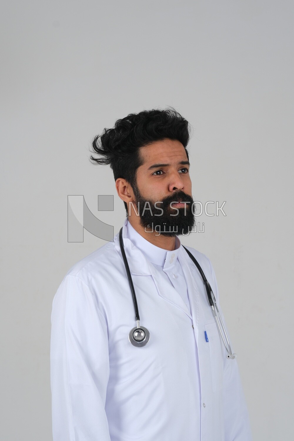 Saudi man wearing a medical coat and a stethoscope, white background, medicine and health care, Saudi model
