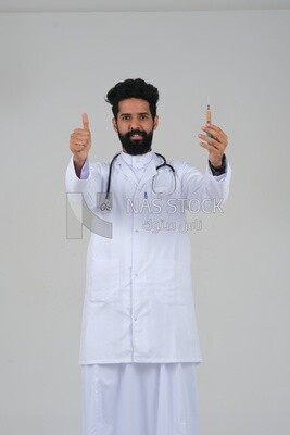 Saudi man wearing a medical coat and a stethoscope, holding a medical needle, white background, medicine and health care, Saudi model