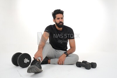 Saudi man doing warm-up exercises, push-ups, bodybuilding, healthy lifestyle, building muscle, white background, Saudi model