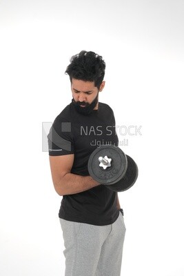 Saudi man Wearing sports clothes, exercising with dumbbells, bodybuilding, healthy lifestyle, building muscle, white background, Saudi model