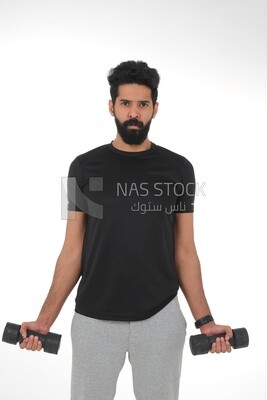 Saudi man Wearing sports clothes, exercising with dumbbells, bodybuilding, healthy lifestyle, building muscle, white background, Saudi model