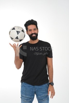 Saudi man holding a ball, playing football,  practicing soccer sports, playing with the ball, white background, Saudi model