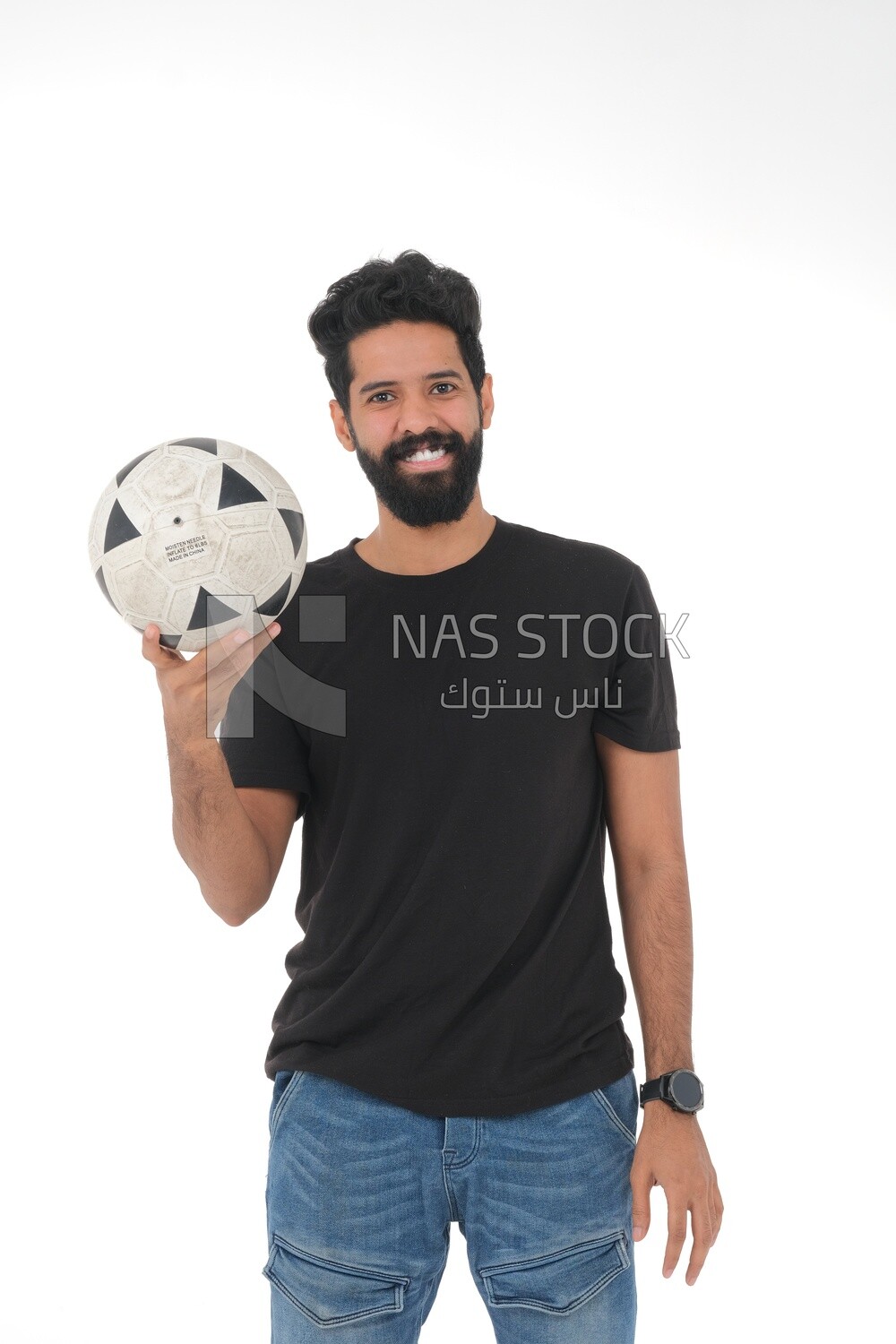 Saudi man holding a ball, playing football,  practicing soccer sports, playing with the ball, white background, Saudi model