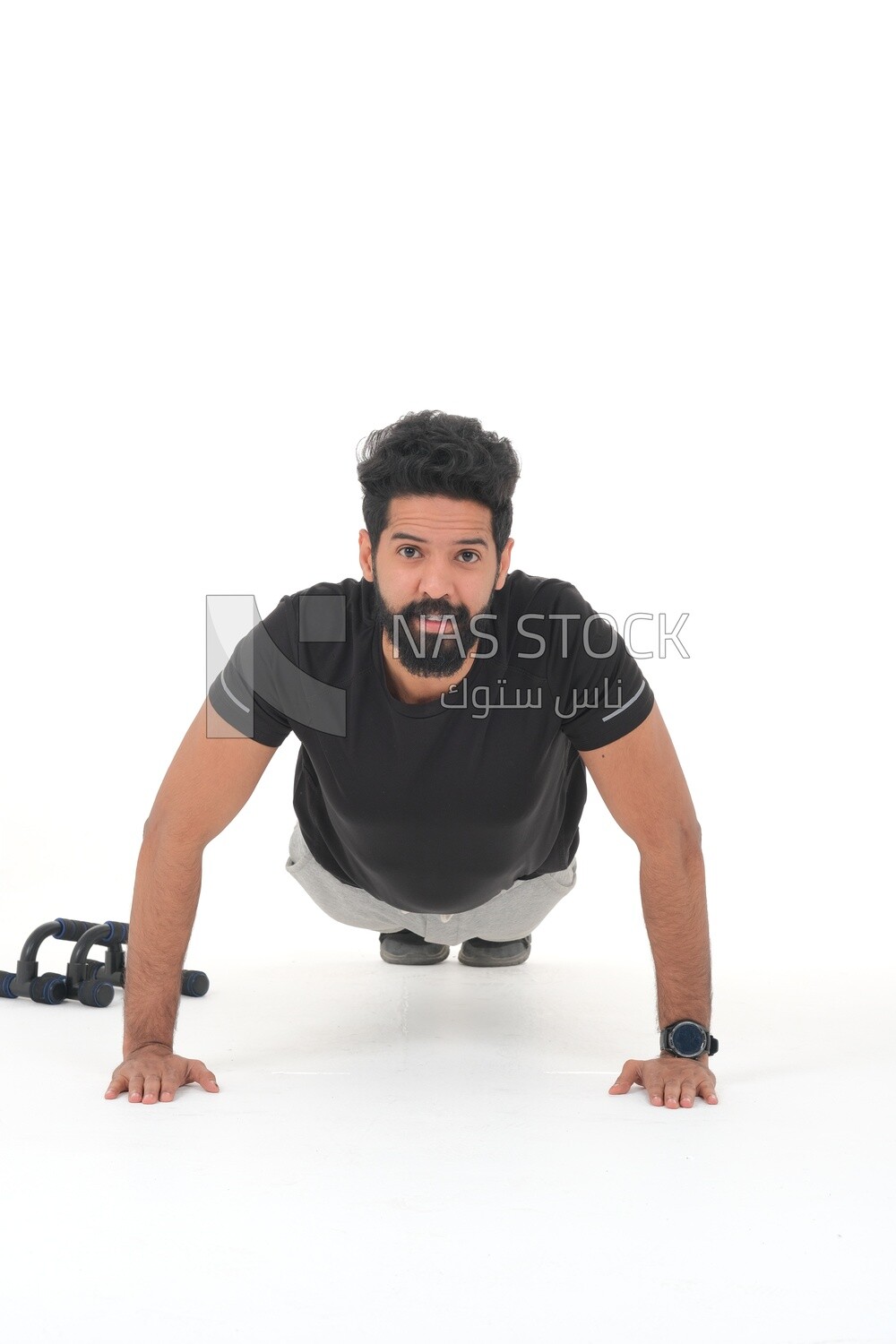 Saudi man doing warm-up exercises, push-ups, bodybuilding, healthy lifestyle, building muscle, white background, Saudi model