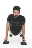 Saudi man doing warm-up exercises, push-ups, bodybuilding, healthy lifestyle, building muscle, white background, Saudi model