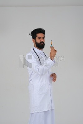 Saudi man wearing a medical coat and a stethoscope, holding a medical needle, white background, medicine and health care, Saudi model