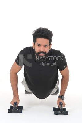 Saudi man doing warm-up exercises, push-ups, bodybuilding, healthy lifestyle, building muscle, white background, Saudi model
