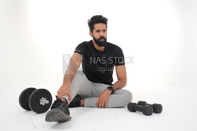 Saudi man doing warm-up exercises, push-ups, bodybuilding, healthy lifestyle, building muscle, white background, Saudi model