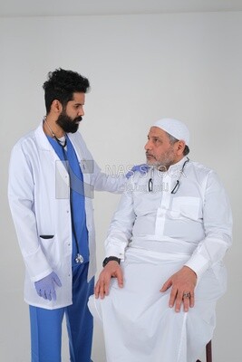 Saudi man wearing a medical coat and a stethoscope and placing his hand on the patient’s shoulder,  providing health services, white background, medicine and health care, Saudi model