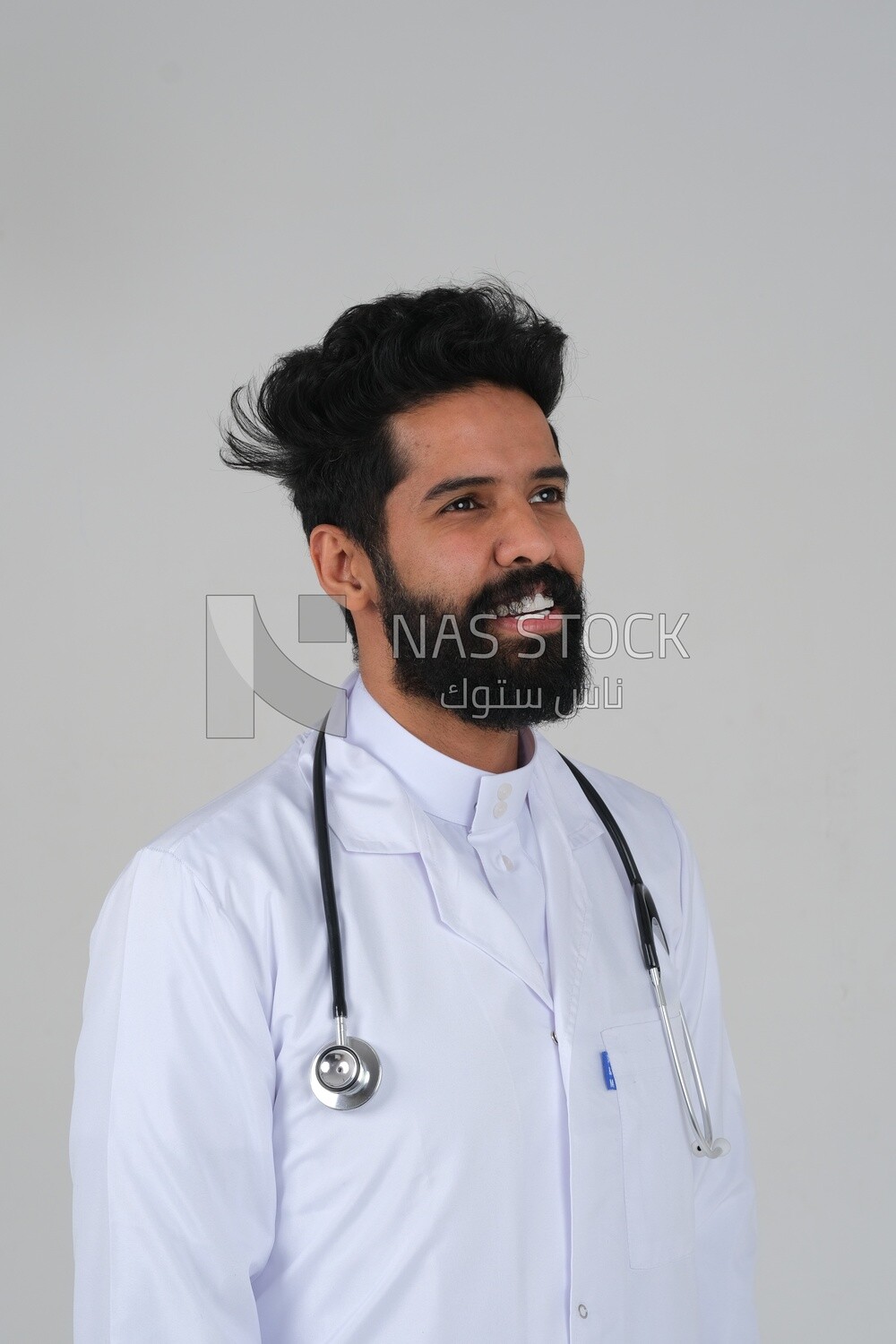 Saudi man wearing a medical coat and a stethoscope, white background, medicine and health care, Saudi model