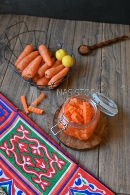 Jar of pickled carrots, a bowl with carrots and lemon, Egyptian pickles, Arab restaurants