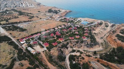 drone footage shows an overview of Ra&#39;s Al Hilal village with sea, landmarks in Libya