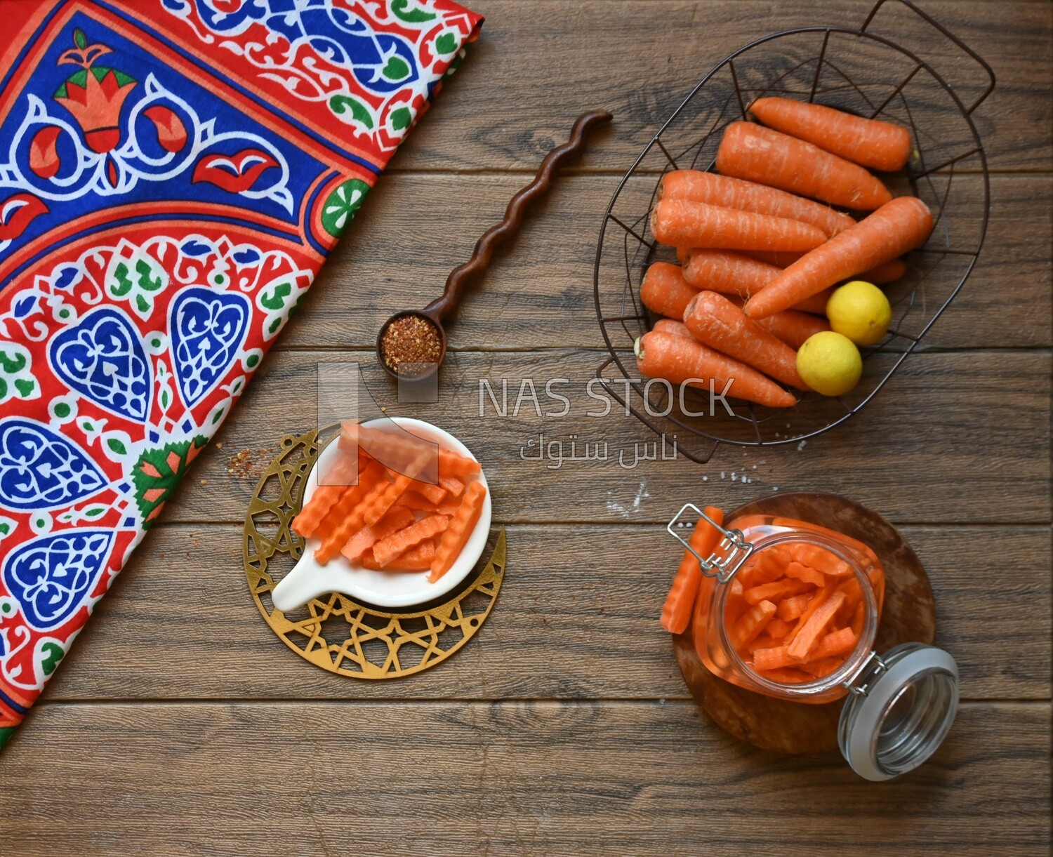 Jar of pickled carrots, a bowl with carrots and lemon, Egyptian pickles, Arab restaurants
