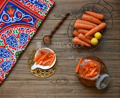 Jar of pickled carrots, a bowl with carrots and lemon, Egyptian pickles, Arab restaurants