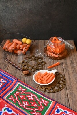 Jar of pickled carrots, a bowl with carrots and lemon, Egyptian pickles, Arab restaurants