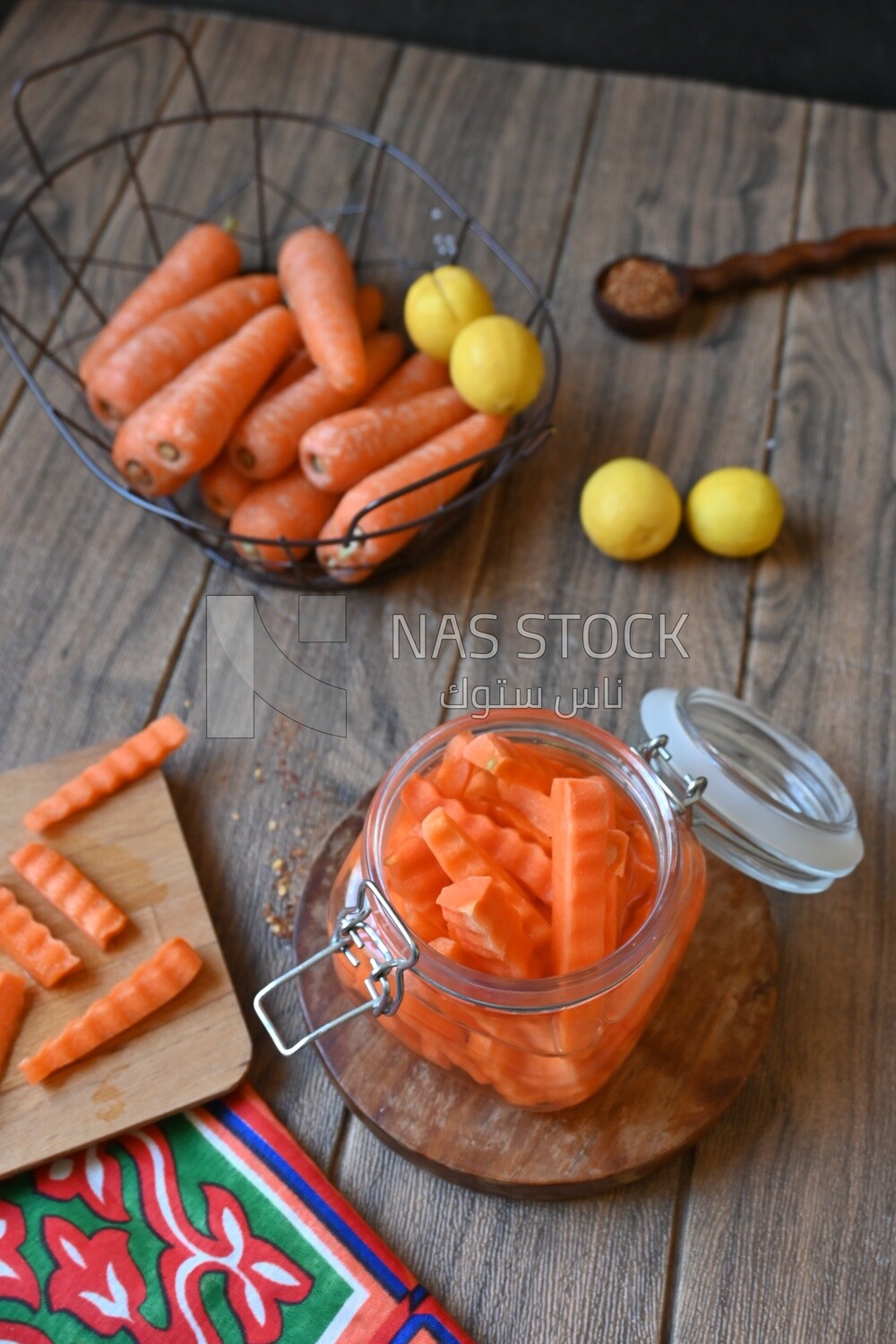Jar of pickled carrots, a bowl with carrots and lemon, Egyptian pickles, Arab restaurants