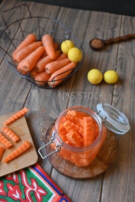 Jar of pickled carrots, a bowl with carrots and lemon, Egyptian pickles, Arab restaurants