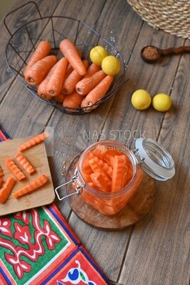 Jar of pickled carrots, a bowl with carrots and lemon, Egyptian pickles, Arab restaurants