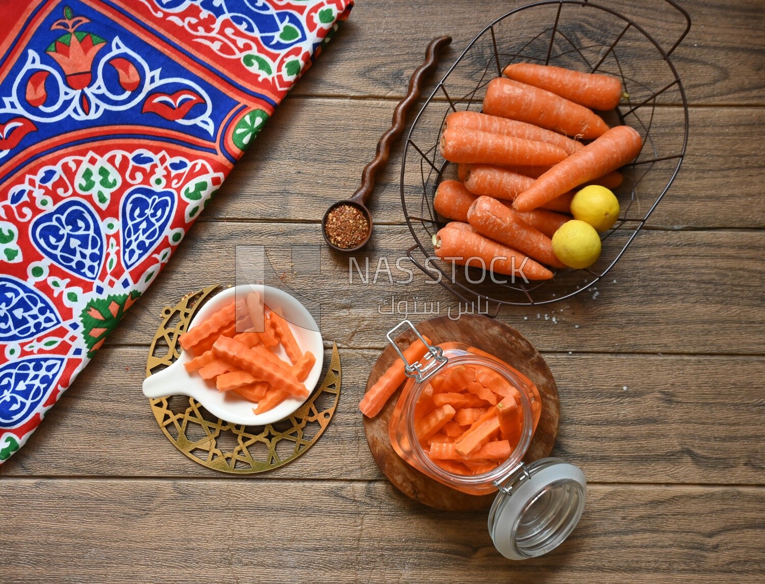 Jar of pickled carrots, a bowl with carrots and lemon, Egyptian pickles, Arab restaurants