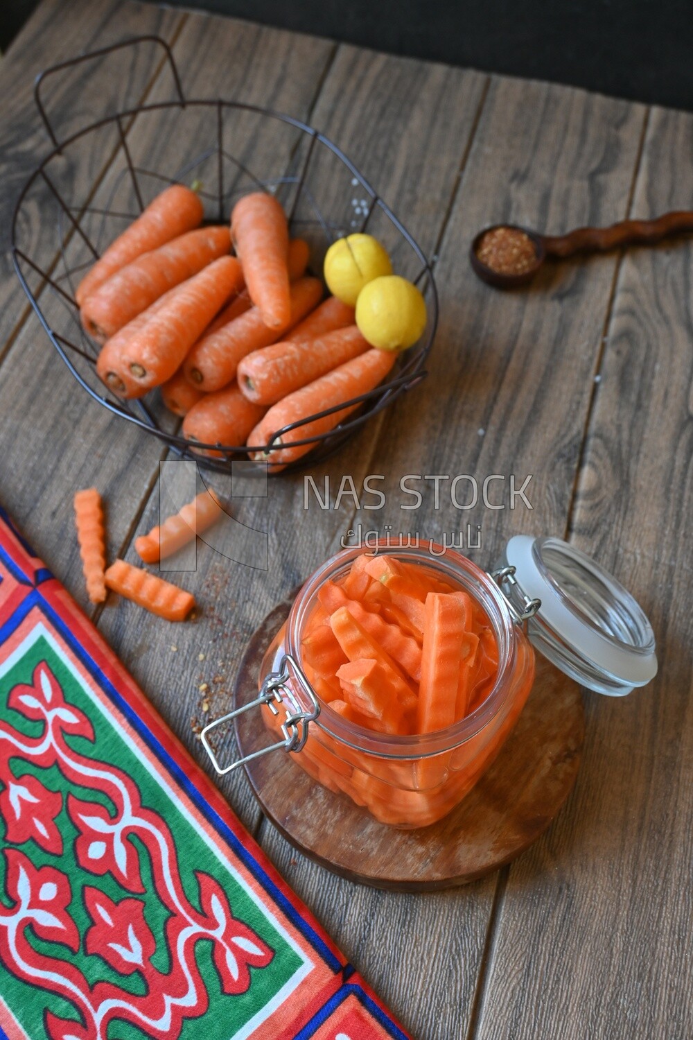 Jar of pickled carrots, a bowl with carrots and lemon, Egyptian pickles, Arab restaurants