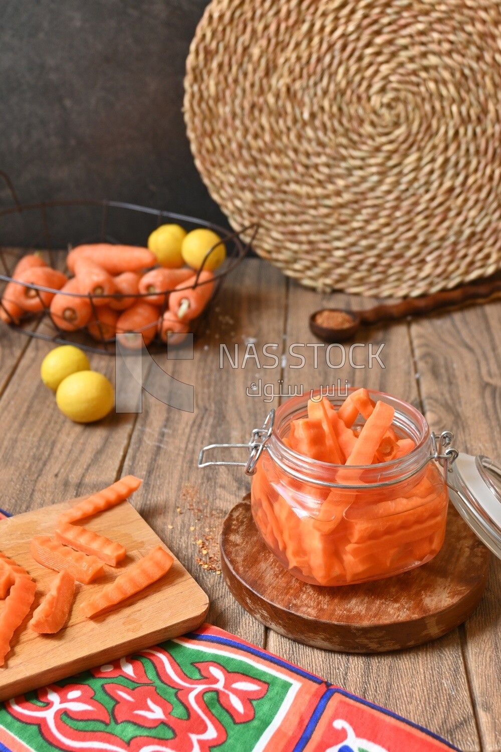 Jar of pickled carrots, a bowl with carrots and lemon, Egyptian pickles, Arab restaurants
