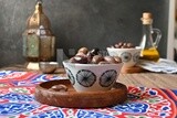 Bowl of Pickled black olives, Egyptian pickles, Arab restaurants