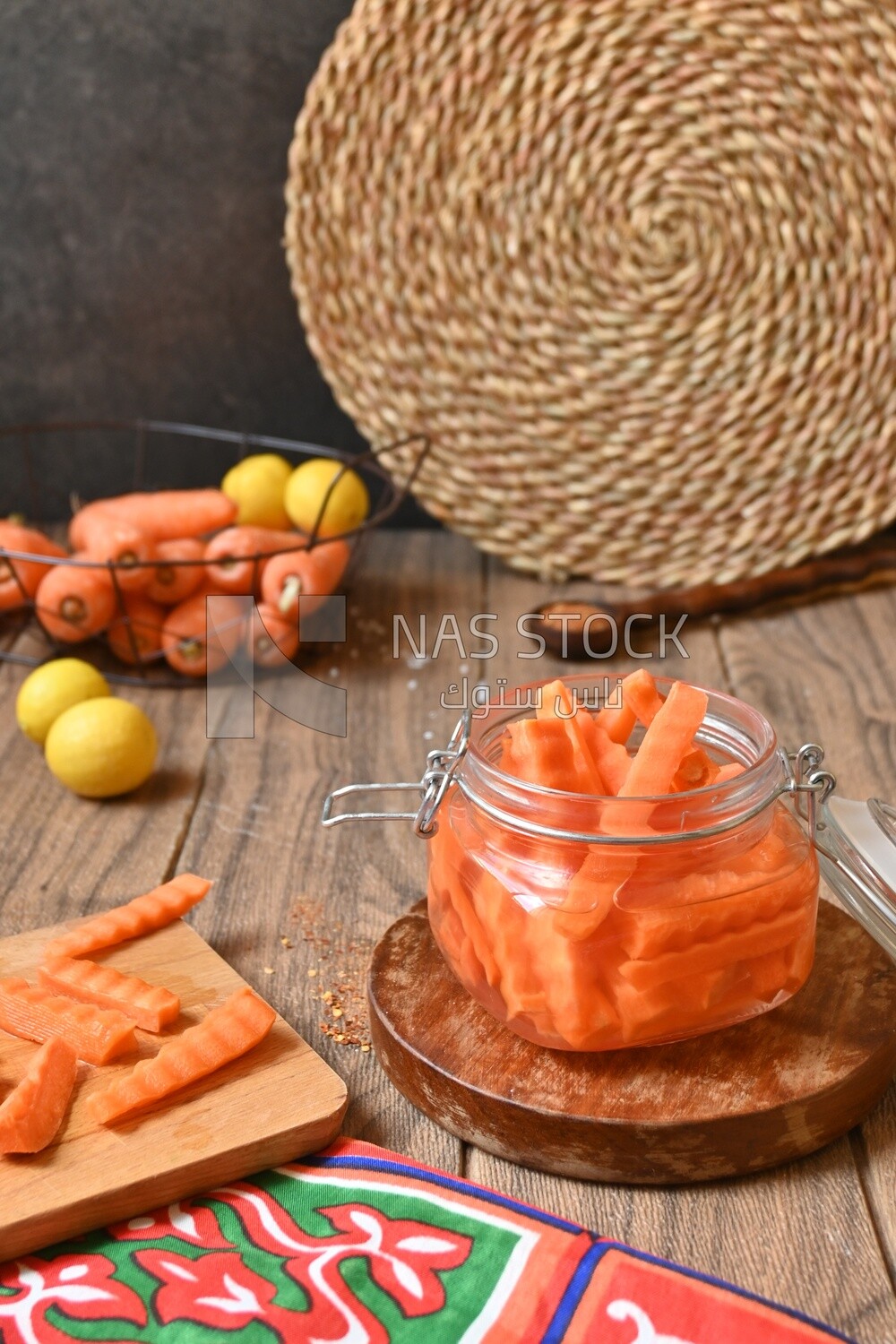 Jar of pickled carrots, a bowl with carrots and lemon, Egyptian pickles, Arab restaurants
