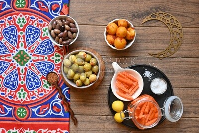 Jar of pickled carrots, a bowl of Pickled black olives, a bowl of Pickled green olives, bowl of Pickled lemon, Egyptian pickles, Arab restaurants