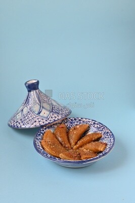 Plate of Qatayef with nuts, oriental Arabic sweets, Ramadan sweets