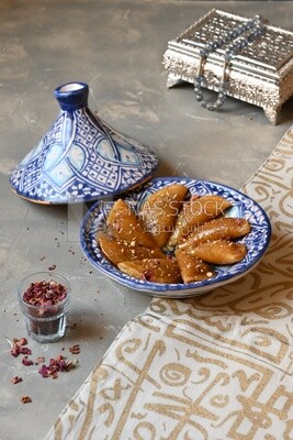 Plate of Qatayef with nuts, oriental Arabic sweets, Ramadan sweets