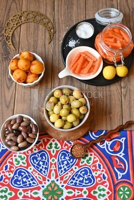 Jar of pickled carrots, a bowl of Pickled black olives, a bowl of Pickled green olives, bowl of Pickled lemon, Egyptian pickles, Arab restaurants