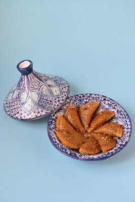 Plate of Qatayef with nuts, oriental Arabic sweets, Ramadan sweets