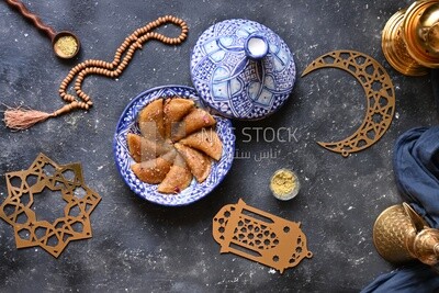 Plate of Qatayef with nuts, oriental Arabic sweets, Ramadan sweets