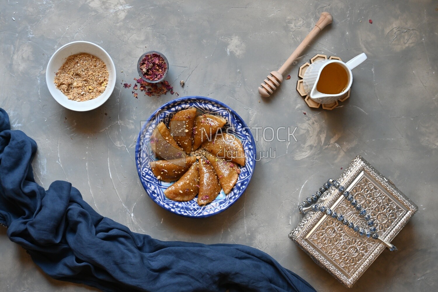 Plate of Qatayef with nuts, oriental Arabic sweets, Ramadan sweets